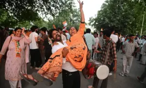 Congress supporters celebrate as BJP falls