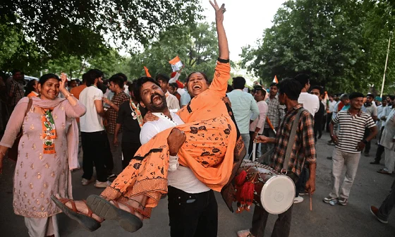Congress supporters celebrate as BJP falls